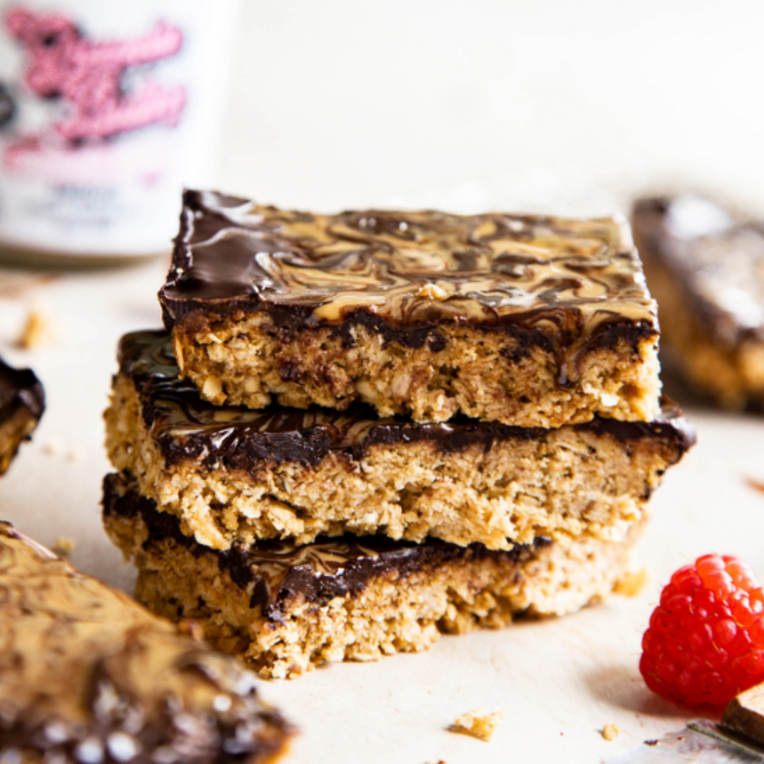 Our nut-free spread combines with oats and syrup to create this perfect harmony. Drizzled Granola Butter on top over the chocolate for a feathered unique pattern